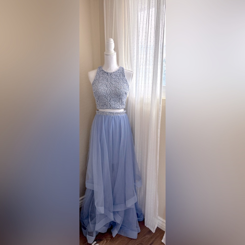 Elegant dress with lace detailing and a very soft purple blue color! Size 3-2